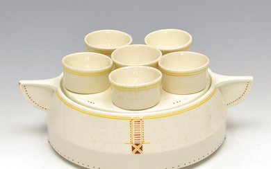 Earthenware egg-set with six egg-cups, with polychrome linear decoration, design...