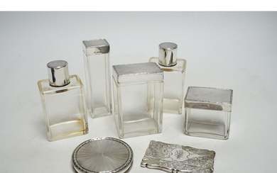 Five assorted silver topped glass toilet jars, a silver comp...