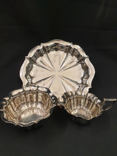 Fluted silver cake plate with sugar bowl and milk jug made b...
