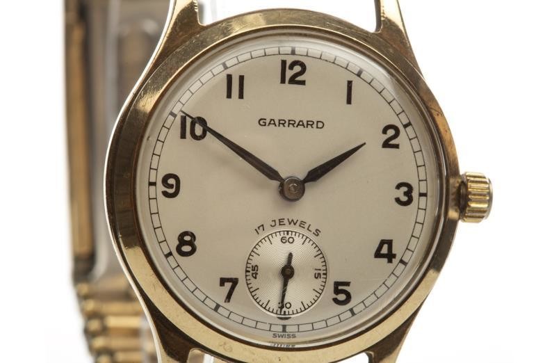 GENTLEMAN'S GARRARD NINE CARAT GOLD MANUAL WIND WRIST WATCH,...