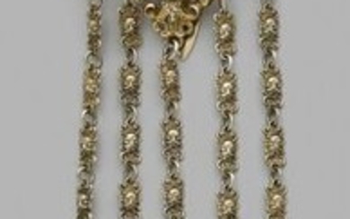 Gilt vermeil chatelaine decorated with mascaron, putti, lion...