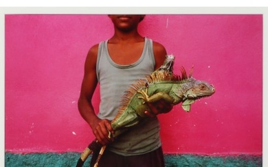 Jeffrey N. Becom, American (b.1953), boy with iguana, photograph