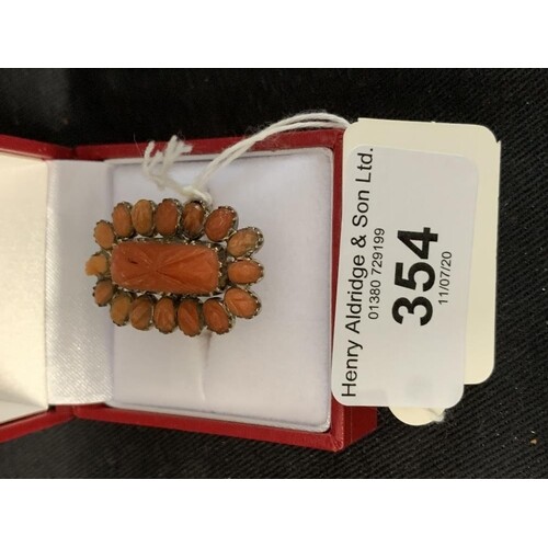 Jewellery: 18ct. Tested carved coral cluster ring, size P. 3...