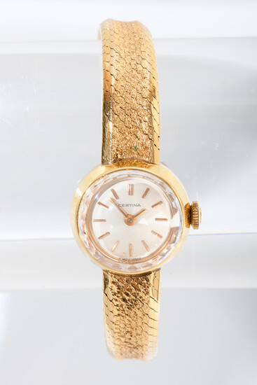 LADY'S CERTINA YELLOW GOLD WRISTWATCH. Circular case with silvered dial...