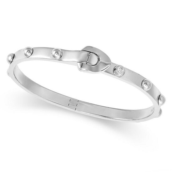 LOUIS VUITTON, A DIAMOND BANGLE in 18ct white gold, the bangle accented with a single diamond and a