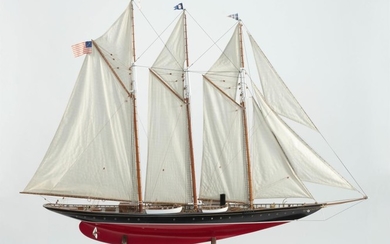 MODEL OF THE THREE-MASTED SCHOONER ATLANTIC Displayed on a wooden cradle. Total height 46". Length 53.25". Width 7.5". The Atlantic...