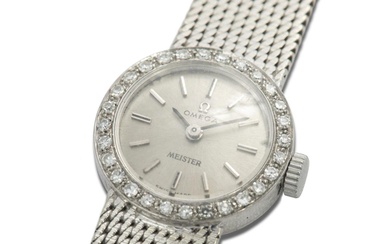Omega: A lady's wristwatch with a diamond set bezel.