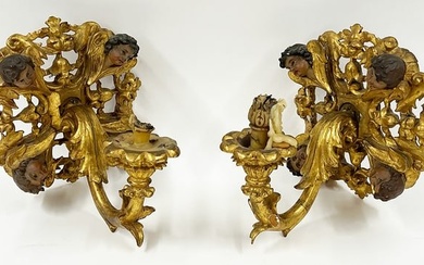PAIR OF ITALIAN CARVED AND POLYCHROMED WALL SCONCES