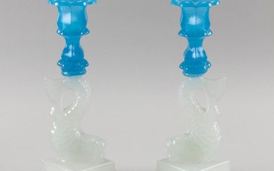 PAIR OF SANDWICH GLASS DOLPHIN-FORM CANDLESTICKS Translucent blue floriform socles and clambroth double-step bases. Heights 9.75".