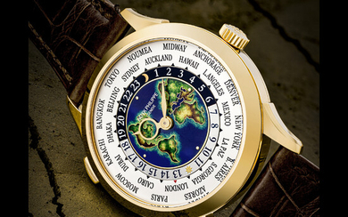 PATEK PHILIPPE. A RARE AND SUPERB 18K GOLD AUTOMATIC WORLD TIME WRISTWATCH WITH CLOISONNÉ ENAMEL DIAL REF. 5231J, CIRCA 2020