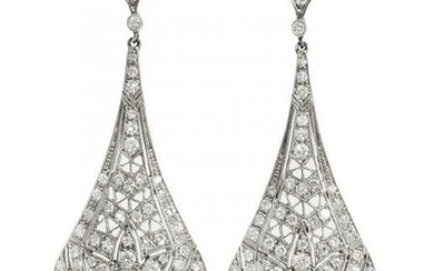 Pair of long movement earrings in platinum and diamonds. Model with wide-blade frontispiece with
