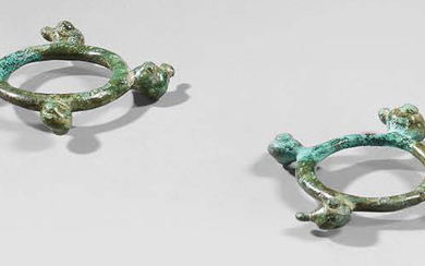 Pair of rings decorated with four zoomorphic heads...