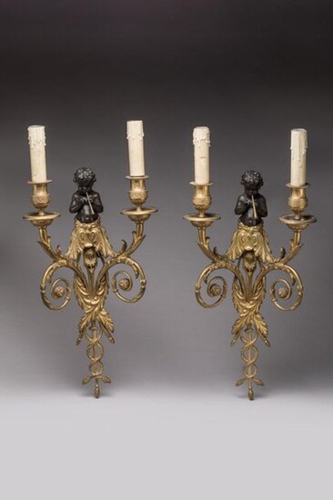 Pair of two-light arm sconces in gilt bronze and brown patina with musician cherubs decoration. The arms of light decorated with acanthus leaves emanating from the node on the child's torso are supported by two scrolls ending with flowers. Louis XVI...