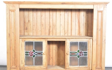 Pine cupboard with glass doors.