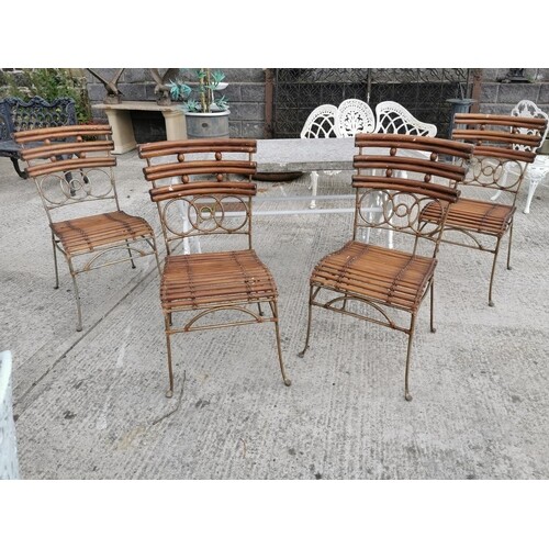Set of four wrought iron and bamboo garden chairs {90 cm H x...