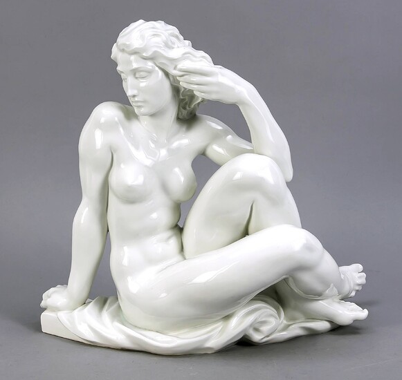 Sinnende, Meissen, mark after 1934, 3rd quality, female nude sitting on curly plinth with drapery in a thoughtful pose. Designed by Robert Ullmann, 1940. Model no. Q 239. Back on the plinth marked. ''Robert Ullmann 1940'', white, h. 33 cm, w. 37 cm