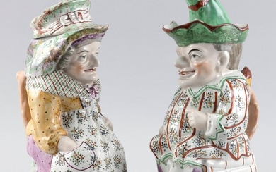 PAIR OF ENGLISH STAFFORDSHIRE PUNCH & JUDY COVERED...