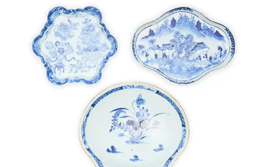 Three Chinese export blue and white saucers Qing dynasty, 18th century Comprising...