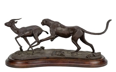 Tim Nicklin (20th century) A bronze group of a cheetah in pu...