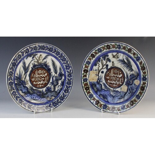 Two Islamic Qajar Dynasty frit ware pottery plates, Iran, ea...