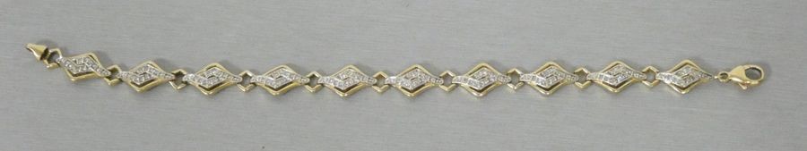Yellow gold bracelet paved with diamonds in a...