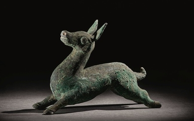 A RARE BRONZE FIGURE OF A DOE WARRING STATES PERIOD - HAN DYNASTY