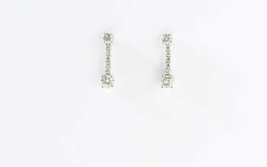 A pair of 14 carat white gold and diamond ear drops