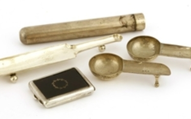 A collection of silver smoking related items