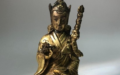 A Gilt Bronze Figure of Padmasambhava