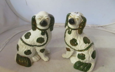 A pair of Staffordshire comforter dogs with copper lustre chains and markings, another large and one smaller (slightly a/f)...