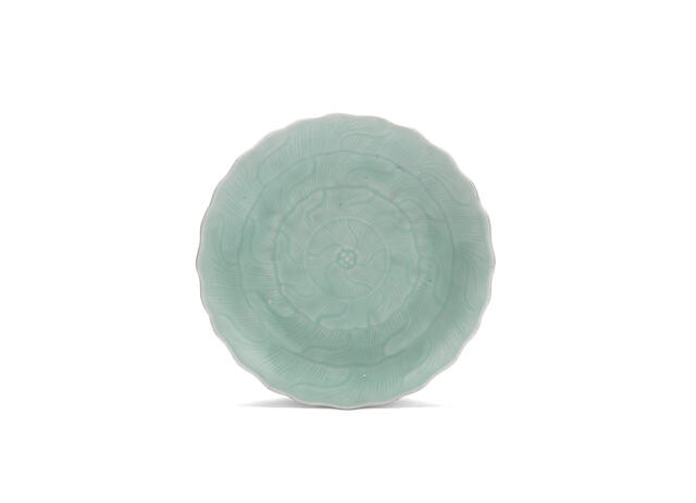 A carved and moulded celadon-glazed 'lotus' dish