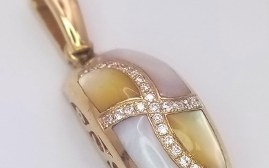 A 14 K yellow gold pendant with yellow and...