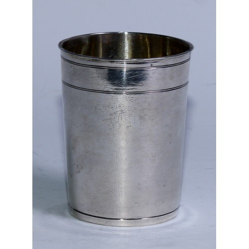 A 17th century German silver cylindrical beaker, slightly fl...