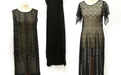 A 1920's Black Beaded Sleeveless Dress, the chiffon ground embellished...