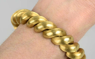 A 1960s textured 18ct gold bracelet, retailed by Kutchinsky.