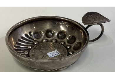 A 19th Century French silver wine taster with coin centre. M...