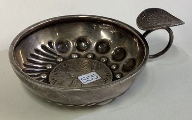 A 19th Century French silver wine taster with coin centre.