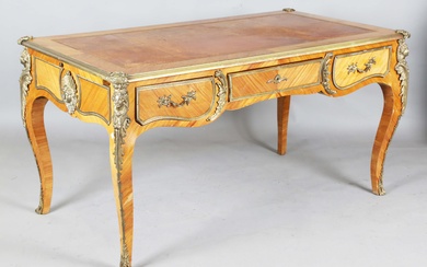 A 20th century French kingwood and gilt metal mounted bureau plat, the top inset with gilt-tooled br