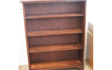 A 20th century mahogany open bookcase fitted three fixed she...