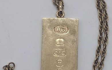 A 9ct gold ingot on a 9ct gold chain,...