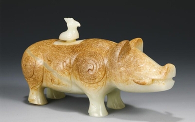 A CARVED WHITE AND RUSSET JADE PIG