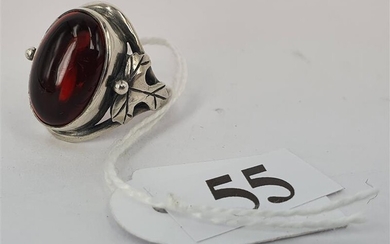 A CHERRY AMBER AND SILVER RING