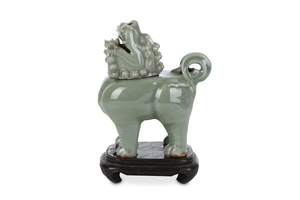 A CHINESE CELADON-GLAZED ‘LION’ INCENSE BURNER AND COVER....