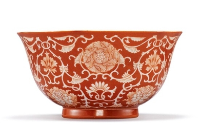 A CORAL-RED RESERVE-DECORATED 'FLORAL' BOWL, QIANLONG SEAL MARK AND PERIOD