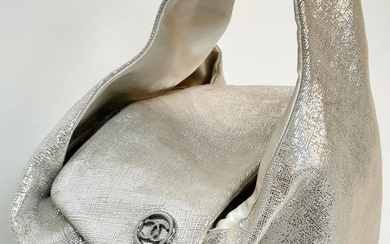 A Chanel Champagne and Silver Shimmer Bag. Leather exterior...