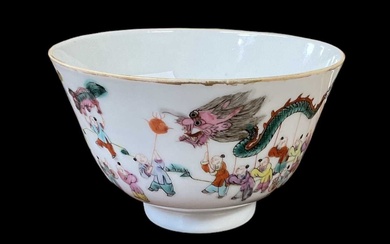 A Chinese porcelain tea bowl decorated with figures and dragons,...