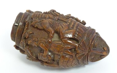 A Continental carved nut snuff bottle with two stylised