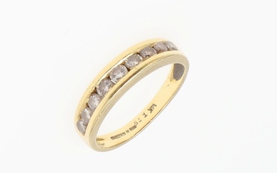 A DIAMOND AND 18CT GOLD HALF HOOP RING. mounted with nine ci...