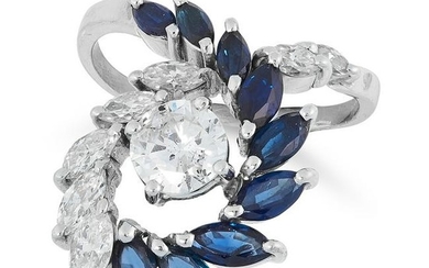 A DIAMOND AND SAPPHIRE DRESS RING set with a central