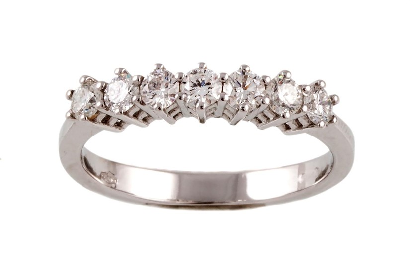 A DIAMOND HALF ETERNITY RING, with diamonds of 0.62ct in tot...